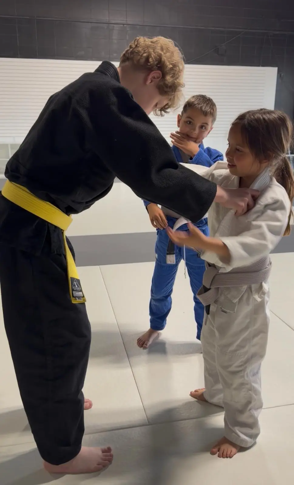 Kids practicing Brazilian Jiu-Jitsu drills