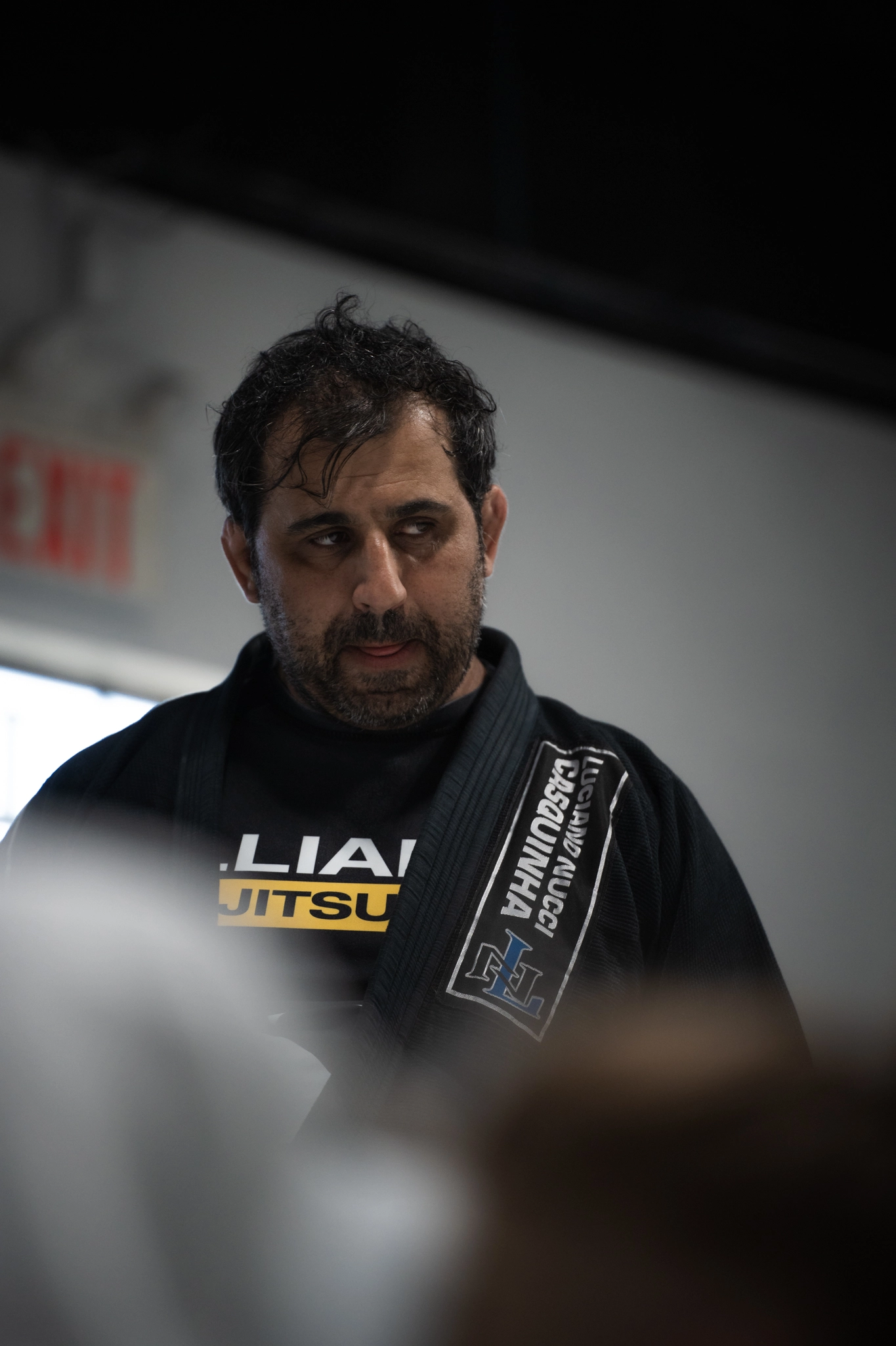 Coach teaching Brazilian Jiu-Jitsu class